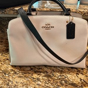 Coach bag!  Super cute and a lot of separation with three compartments.
